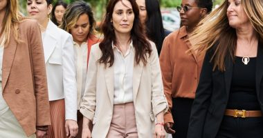A group of women walking outside a courthouse.