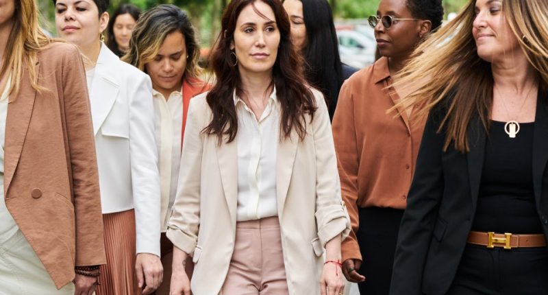 A group of women walking outside a courthouse.