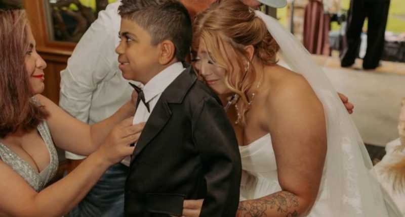 Bride walks down aisle with boy who received her son's donated heart