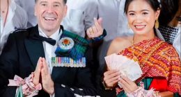 Graeme Davidson and his bride at their Thai wedding ceremony.