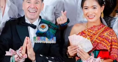 Graeme Davidson and his bride at their Thai wedding ceremony.