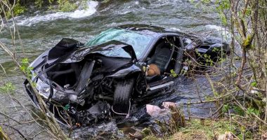 Severely damaged Ferrari in a river.