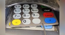 Image of a card reader with a keypad overlay that appears to be a skimming device.