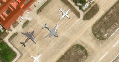 Aerial view of multiple aircraft parked on a tarmac.