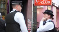 Police officers outside the 100 Club in Oxford Street, London.