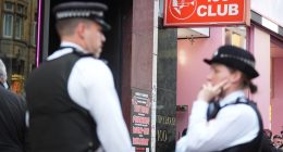 Police officers outside the 100 Club in Oxford Street, London.