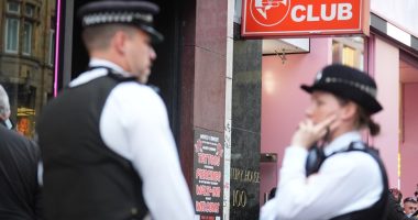 Police officers outside the 100 Club in Oxford Street, London.