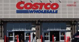 People entering and exiting a Costco Wholesale store.