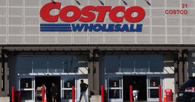 People entering and exiting a Costco Wholesale store.