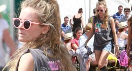 Cressida Bonas sports messy bedhead hair and hotpants at Glastonbury