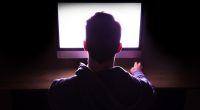 Silhouette of a man's head and shoulders.