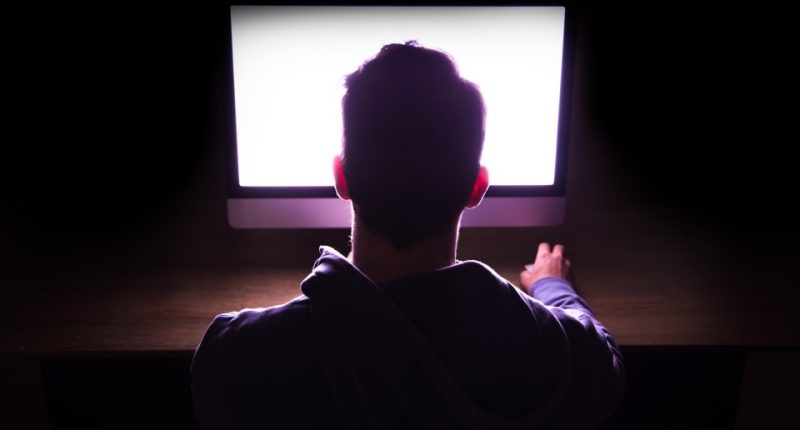 Silhouette of a man's head and shoulders.