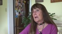 Screenshot of a news segment about a debit card scam featuring an interview with a woman.