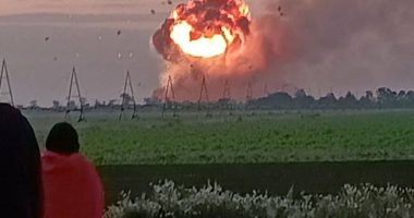 Ammunition depot exploding in fireball.