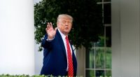 Donald Trump gestures outside the White House