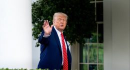 Donald Trump gestures outside the White House