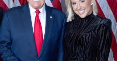 Savannah Chrisley and Donald Trump posing together.