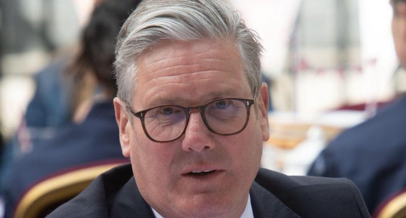 Head-and-shoulders portrait of British Prime Minister Sir Keir Starmer.