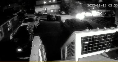 Nighttime security camera footage showing a vehicle leaving a scene.