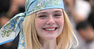Elle Fanning looks 70s chic as she steps out in Cannes