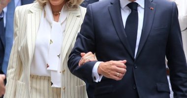 Emmanuel and Brigitte Macron arriving at the Hanoi University of Science and Technology.