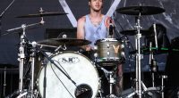 Daniel Williams of The Devil Wears Prada drumming at the Vans Warped Tour.