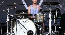 Daniel Williams of The Devil Wears Prada drumming at the Vans Warped Tour.