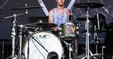 Daniel Williams of The Devil Wears Prada drumming at the Vans Warped Tour.