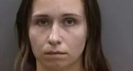 Mugshot of a woman in an orange jumpsuit.