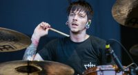 Daniel Williams of The Devil Wears Prada drumming at a music festival.