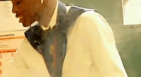 Man wearing a medal and earphones.