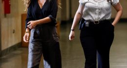 Miriam Haley, accuser in the Harvey Weinstein trial, walking in a courthouse hallway.