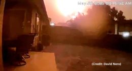 Screenshot of a large fire at night.