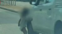 Toddler in diaper running into a road.