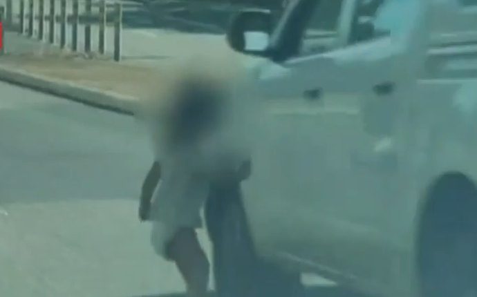 Toddler in diaper running into a road.