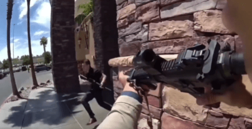 Person aiming a rifle at another person running away.