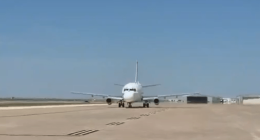 Airplane taxiing on a runway.
