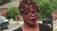 Woman interviewed about HOA settlement.