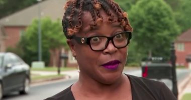 Woman interviewed about HOA settlement.