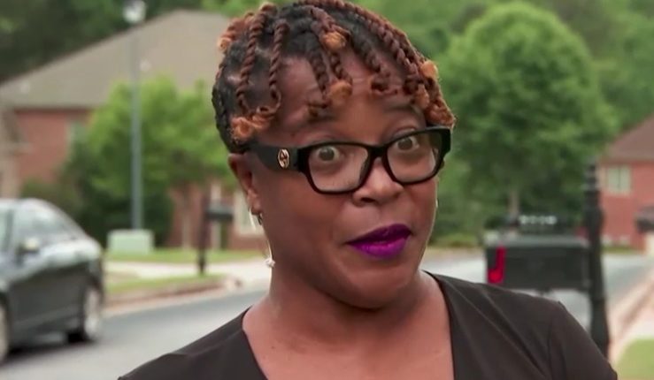 Woman interviewed about HOA settlement.