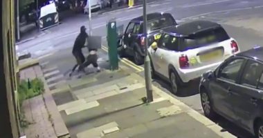 Security camera footage of a robbery.