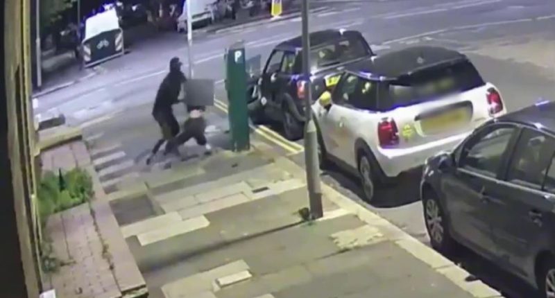 Security camera footage of a robbery.