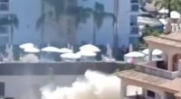 Water pipe explosion causing brown water to flow into the sea near hotels.