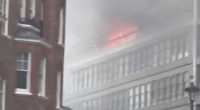 Building fire with smoke.