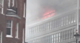 Building fire with smoke.