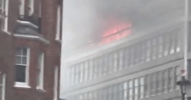 Building fire with smoke.