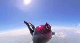 Skydiver falling from a great height.