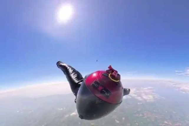 Skydiver falling from a great height.