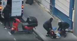 Footage of three masked men forcing a woman into a van.