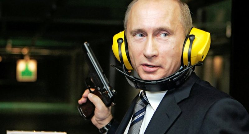 Vladimir Putin at a shooting range, holding a handgun.